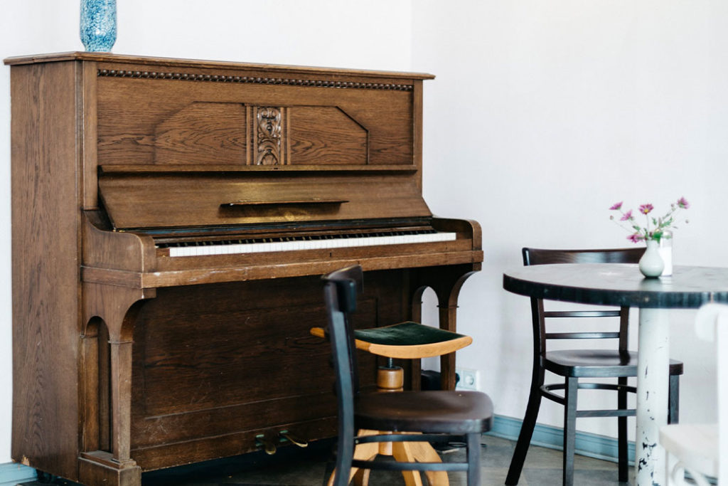 An Upright Piano in a Living Room